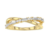 Elegant 10K Yellow Gold Ladies Crossover Ring Featuring Alternating Round And Baguette Diamonds 0.20 Ct. A Modern Fine Jewelry Design For Women.